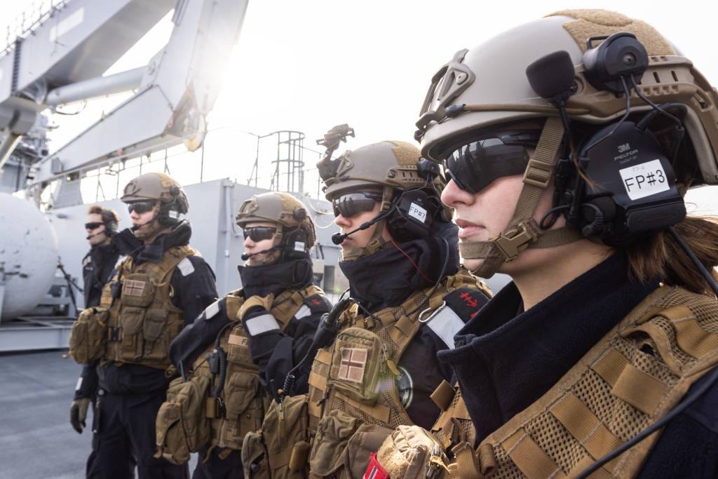 Norwegian Armed Forces personnel in tactical gear aboard a naval vessel during Cold Response 2026