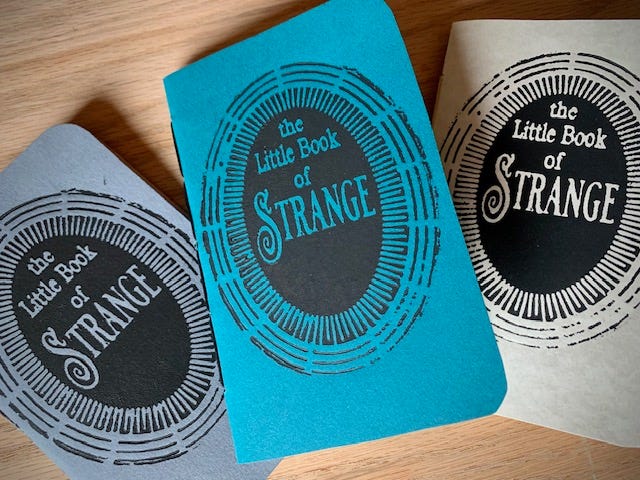 A gallery of four images includes: three small handbound notebooks and a vintage typewriter