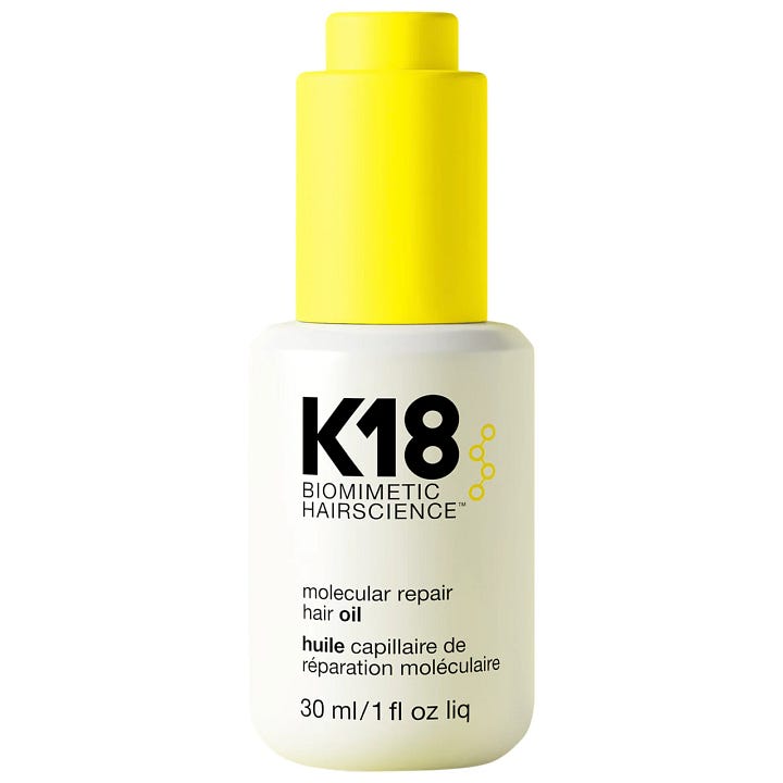 K18 Leave-In Molecular Repair Hair Mask and K18 Molecular Repair Hair Oil bottles side by side for a humidity proof summer hair routine