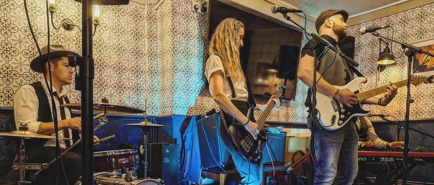 May be an image of 3 people and guitar