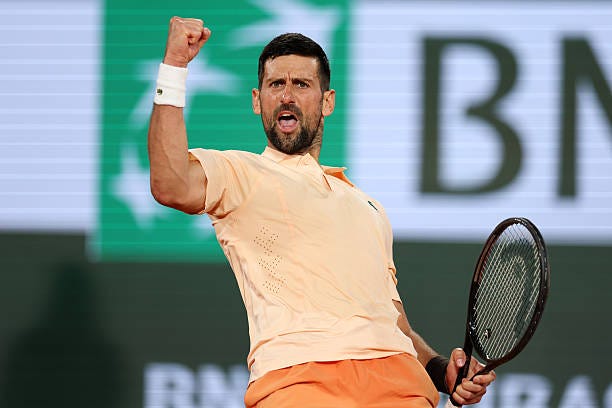Novak Djokovic of Serbia celebrates against Giovanni Mpetshi Perricard of France in their Men's Singles first round match during Day One of the 2026...