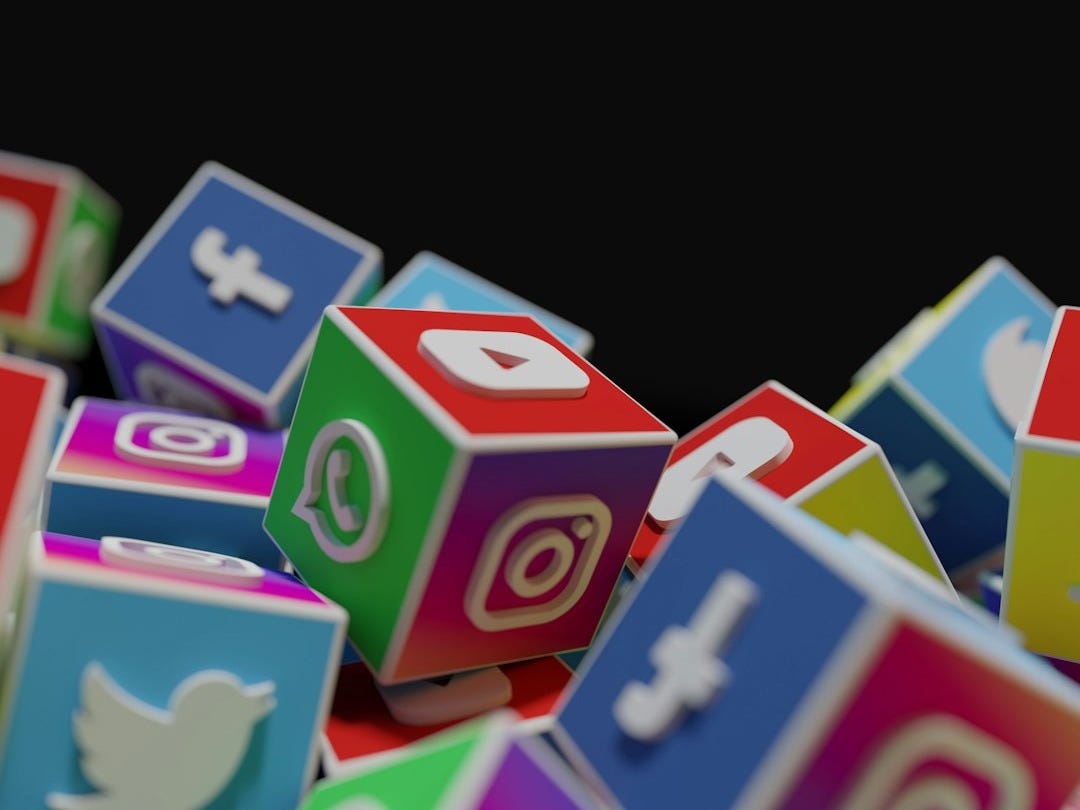 a pile of colorful blocks with social icons on them