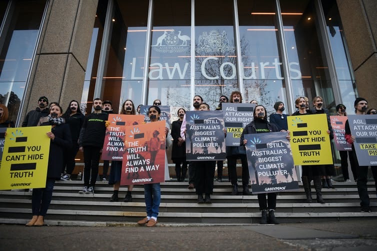 Greenpeace campaigners protest against AGL in Sydney on June 2 2021.