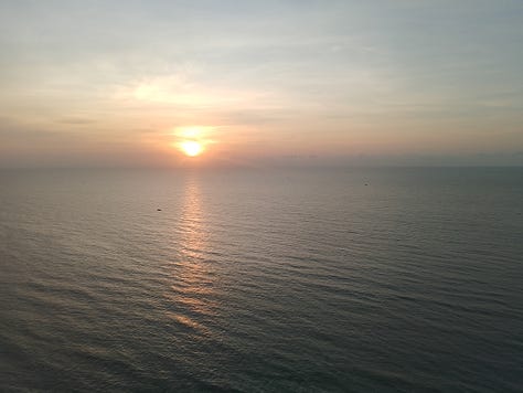 Three sunrise photographs from my solo trip to Cha-am, Thailand, showing calm ocean water, changing morning skies, and light reflecting across the sea.