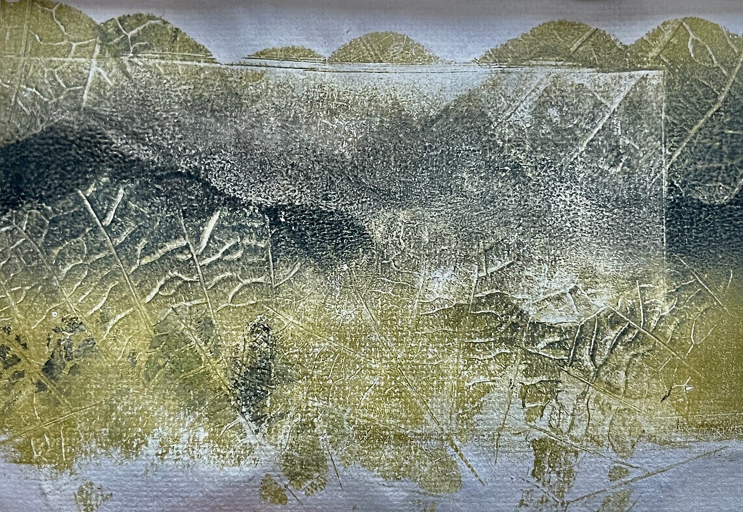 Freshly fallen alder leaves resemble hills in a green and black monoprint Freshly fallen alder leaves resemble hills in a green and black monoprint
