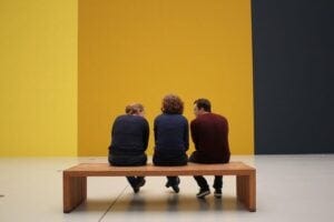 Museum attendees in front of a painting
