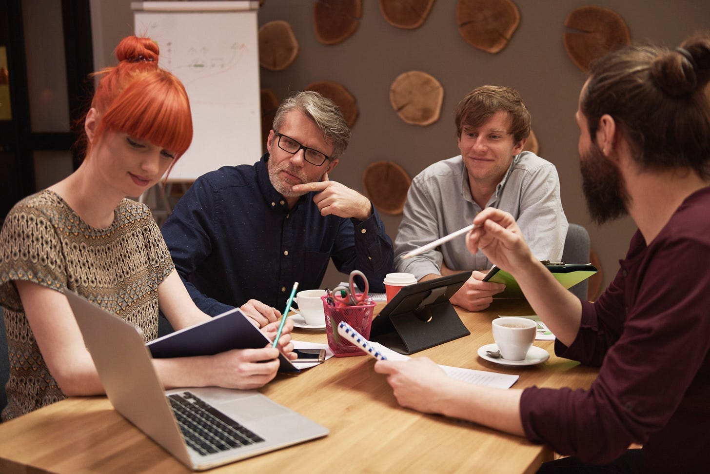 Group of creative people analyzing the result of work - Image by gpointstudio on Freepik