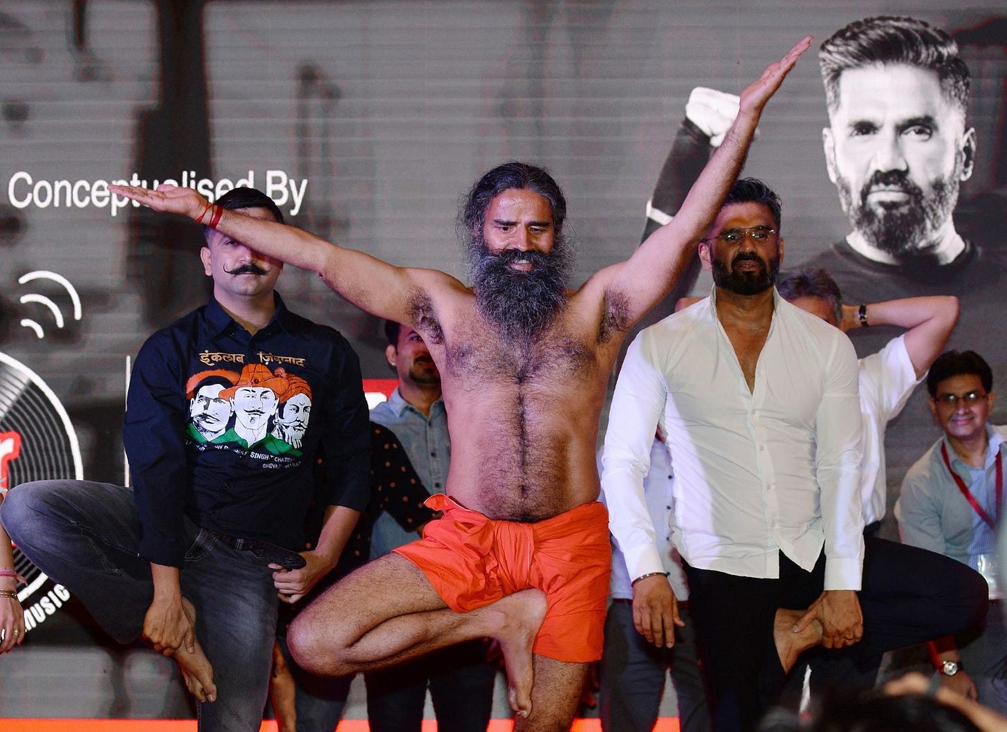 Baba Ramdev, center, with Bollywood actor Suniel Shetty.