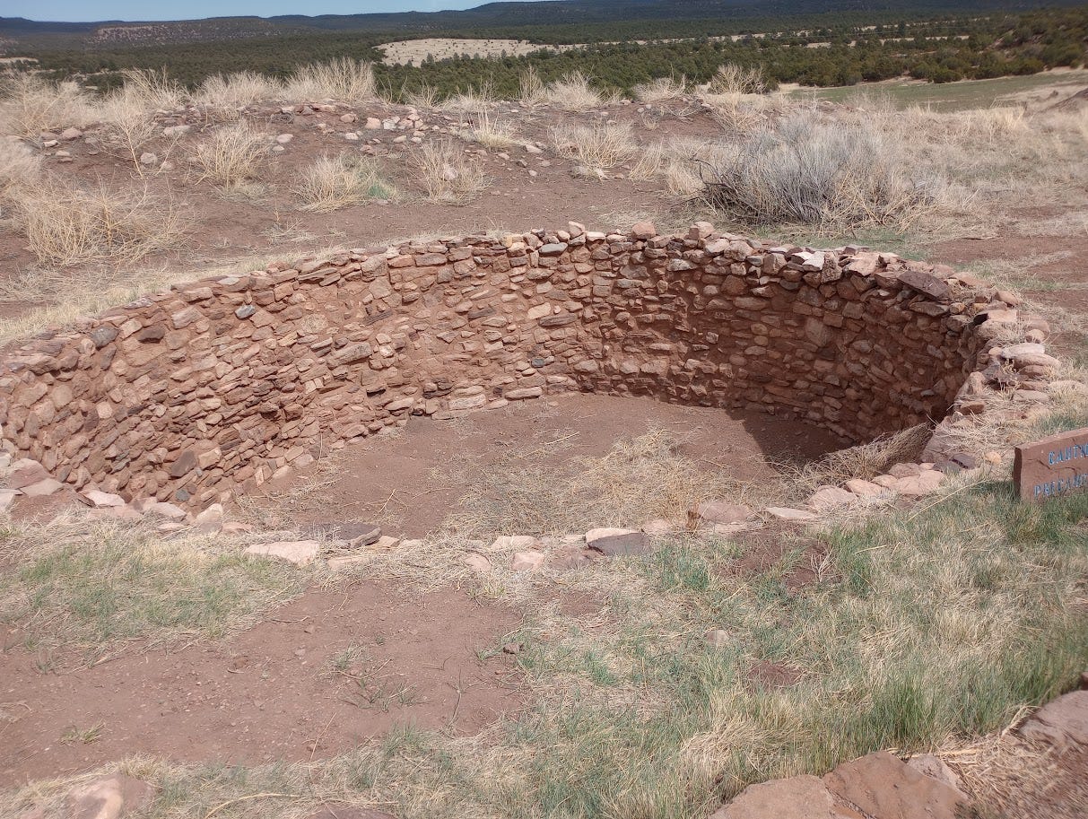 Stone-lined pit in ground