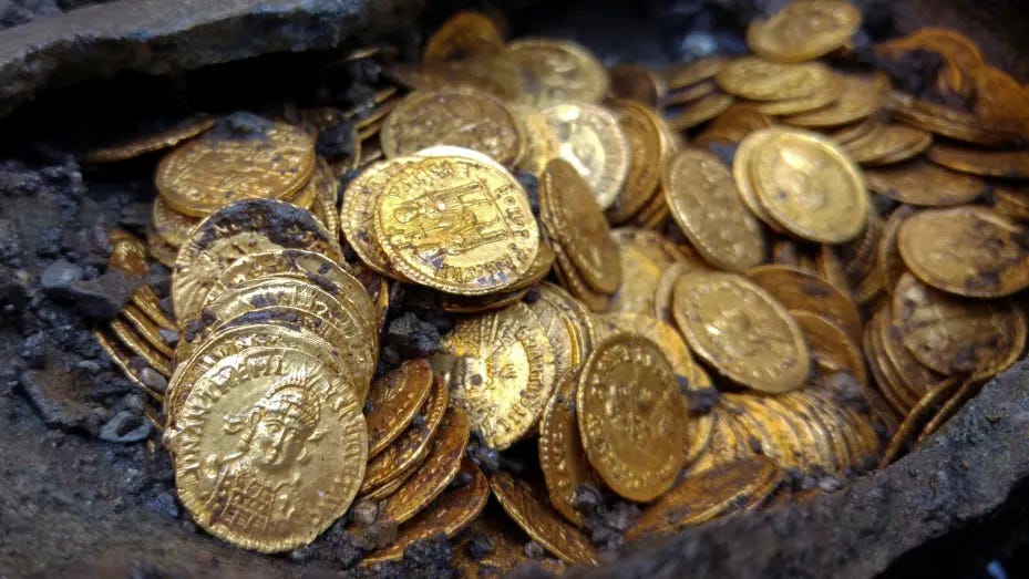 An amphora filled with ancient gold Roman coins found in the Cressoni theatre complex is seen in Como Italy, September 5, 2018. 