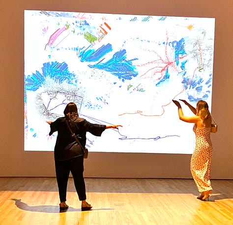 Visitor interacting with the art at the Run the Code exhibit
