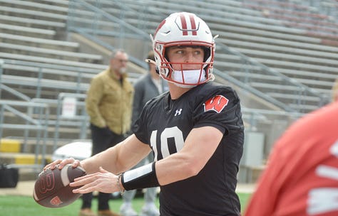 Wisconsin quarterbacks participate in individual position drills during Saturday's spring practice inside Camp Randall Stadium.