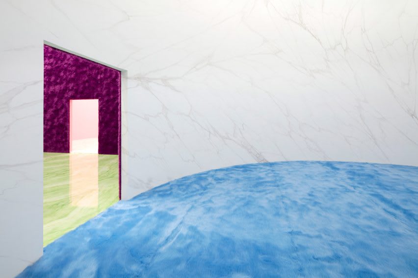 white marble walled circular room at Prada show
