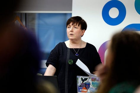Images from the Disabled Women and Poverty event. Images include photos of group discussions and Alice reading a poem from the podium.