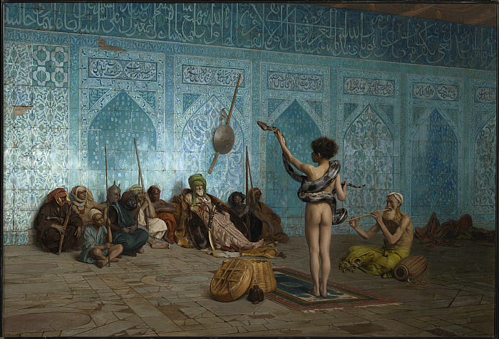 Nude boy charming a snake before a seated crowd Nude boy charming a snake before a seated crowd