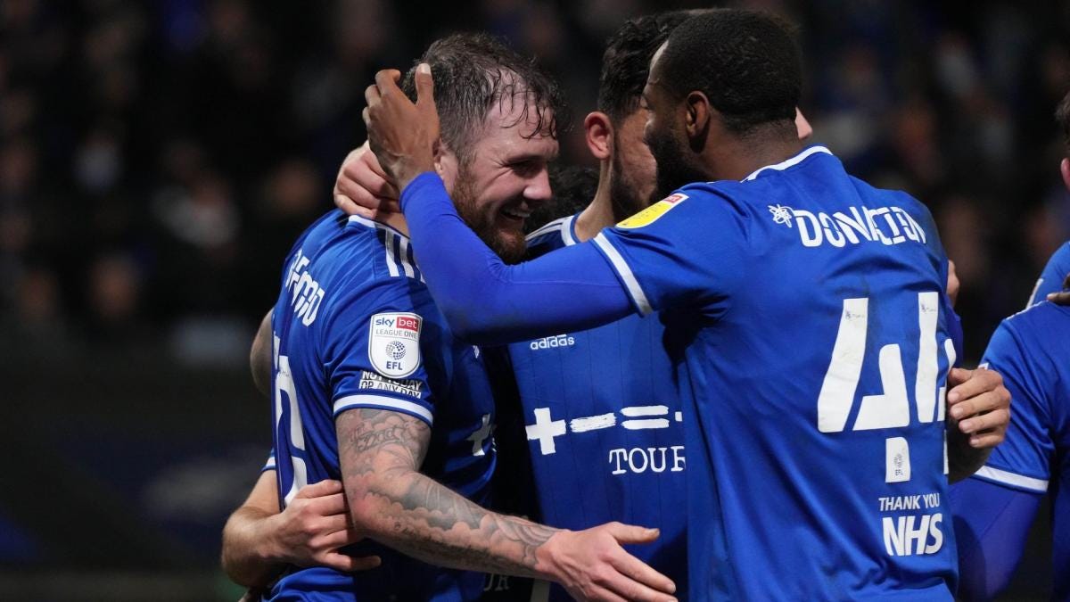 James Norwood celebrates scoring against Wycombe at Portman Road (December 2021)