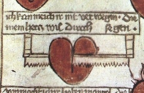 This may contain: an old manuscript with two hearts on it