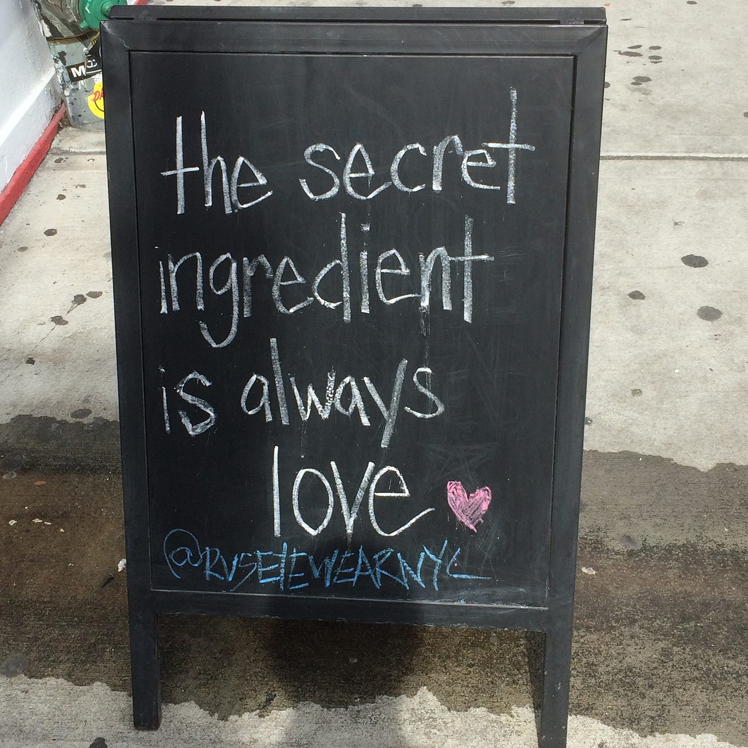 Sidewalk sign "The secret ingredient is always love"