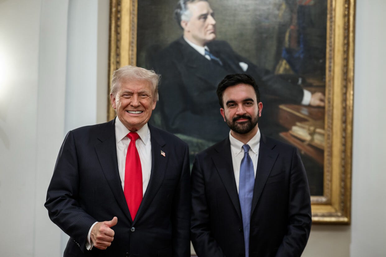 Trump and Mamdani standing in front of a painting of FDR. Trump is grinning and giving a thumbs up sign. Mamdani is not grinning and is not giving a thumbs up sign.