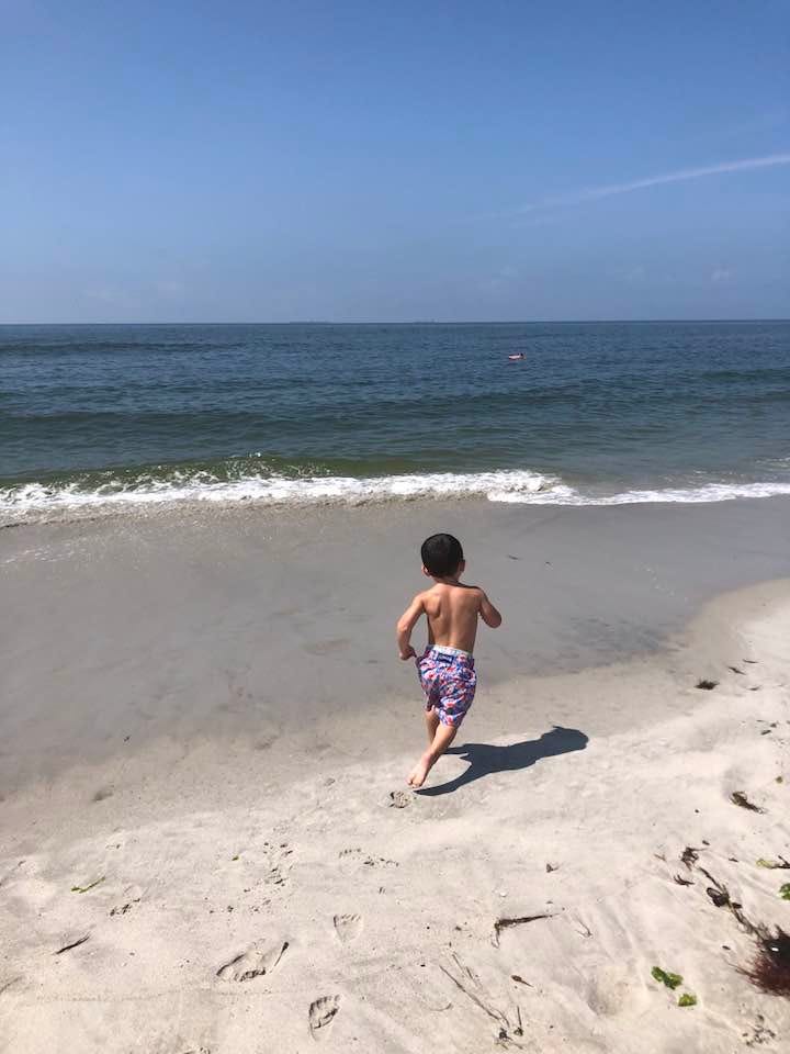May be an image of 1 person, beach and ocean