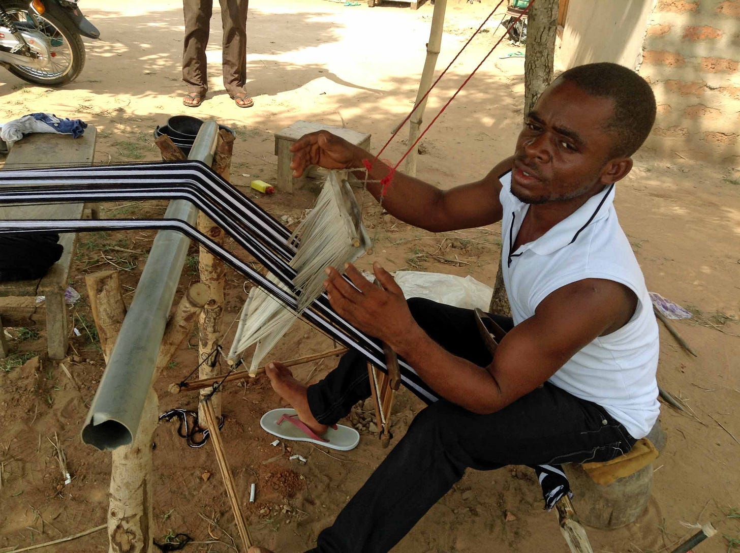 Cloth Weaving by a Tiv Man in Mukurdi, Benue State, Nigeria Cloth Weaving by a Tiv Man in Mukurdi, Benue State, Nigeria