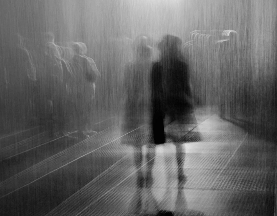 grayscale photo of 2 person walking on the street