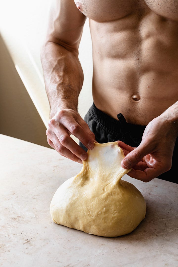 Shirtless man showing steps to make vegan olive oil brioche dough