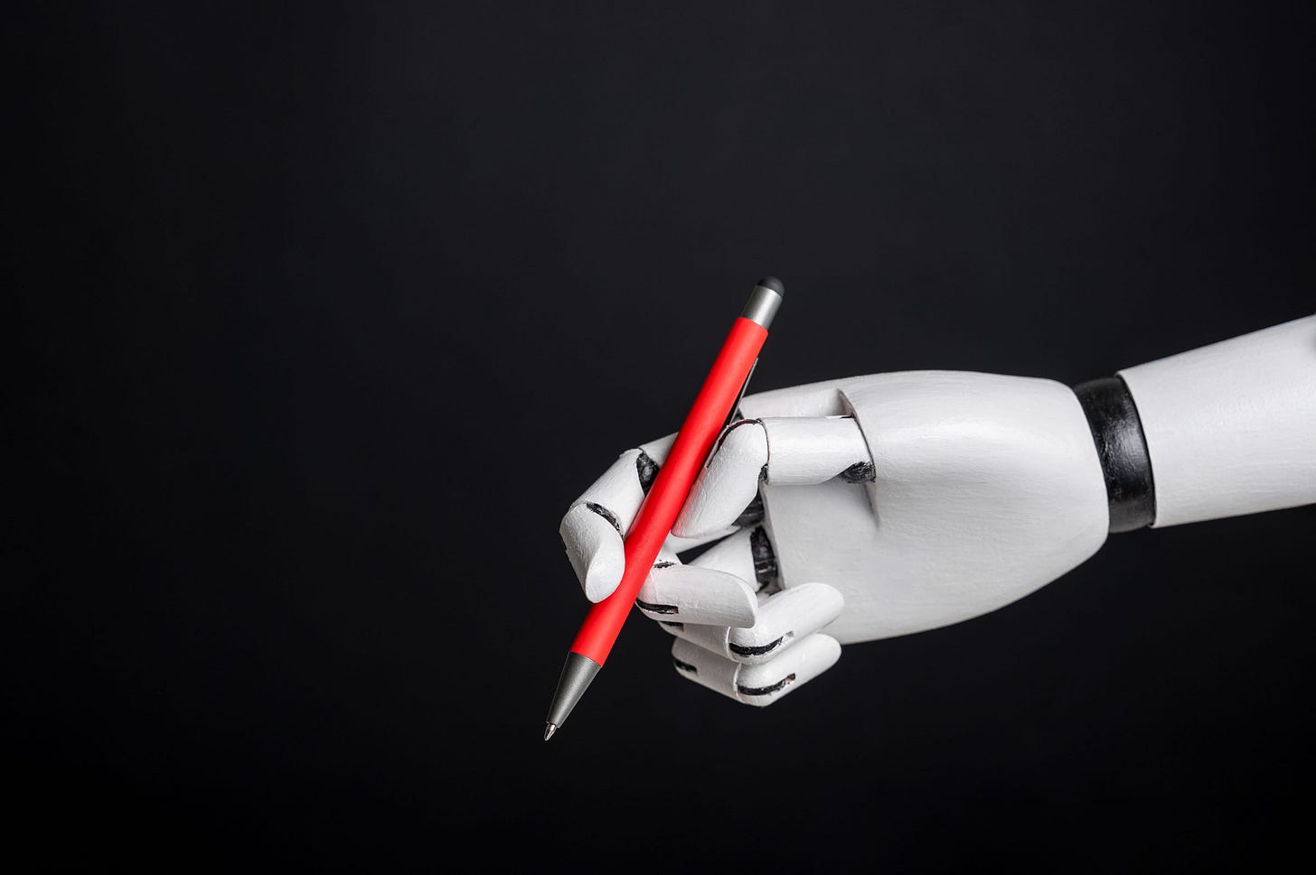 Robotic hand holding pen