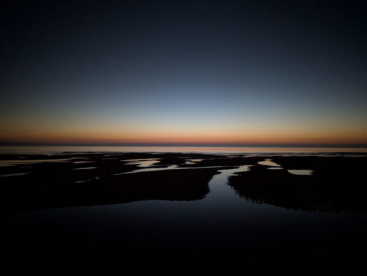 View across the beach and sea at twilight