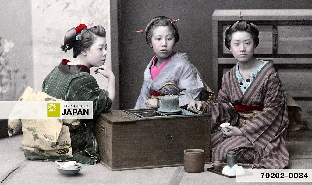 Japanese women posing at a nagahibachi, 1890s