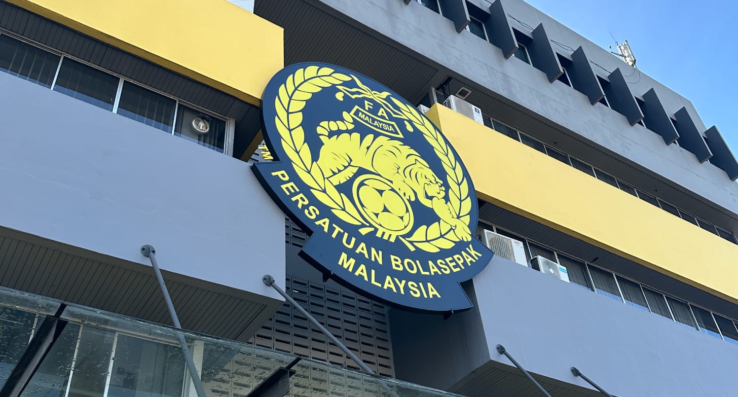 "Football Association of Malaysia logo displayed at press event after FIFA fined FAM and banned seven naturalized players." "Football Association of Malaysia logo displayed at press event after FIFA fined FAM and banned seven naturalized players."