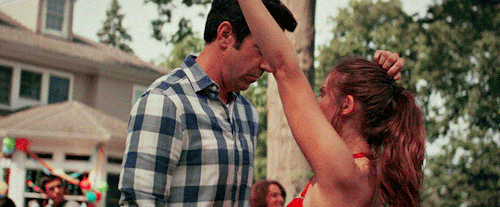 Jason Sudeikis and Alison Brie dancing at a party