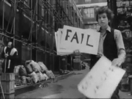 Gif animé extrait de la vidéo de Bob Dylan Subterranean Homesick Blues au moment où il a la pancarte FAIL.