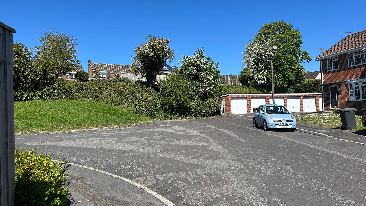 A bank of earth cut out by extracting clay at what is now Cloford Close, Trowbridge. This is the former site of the Cockhill Brick and Tile Works, Cockhill, Trowbridge, Wiltshire