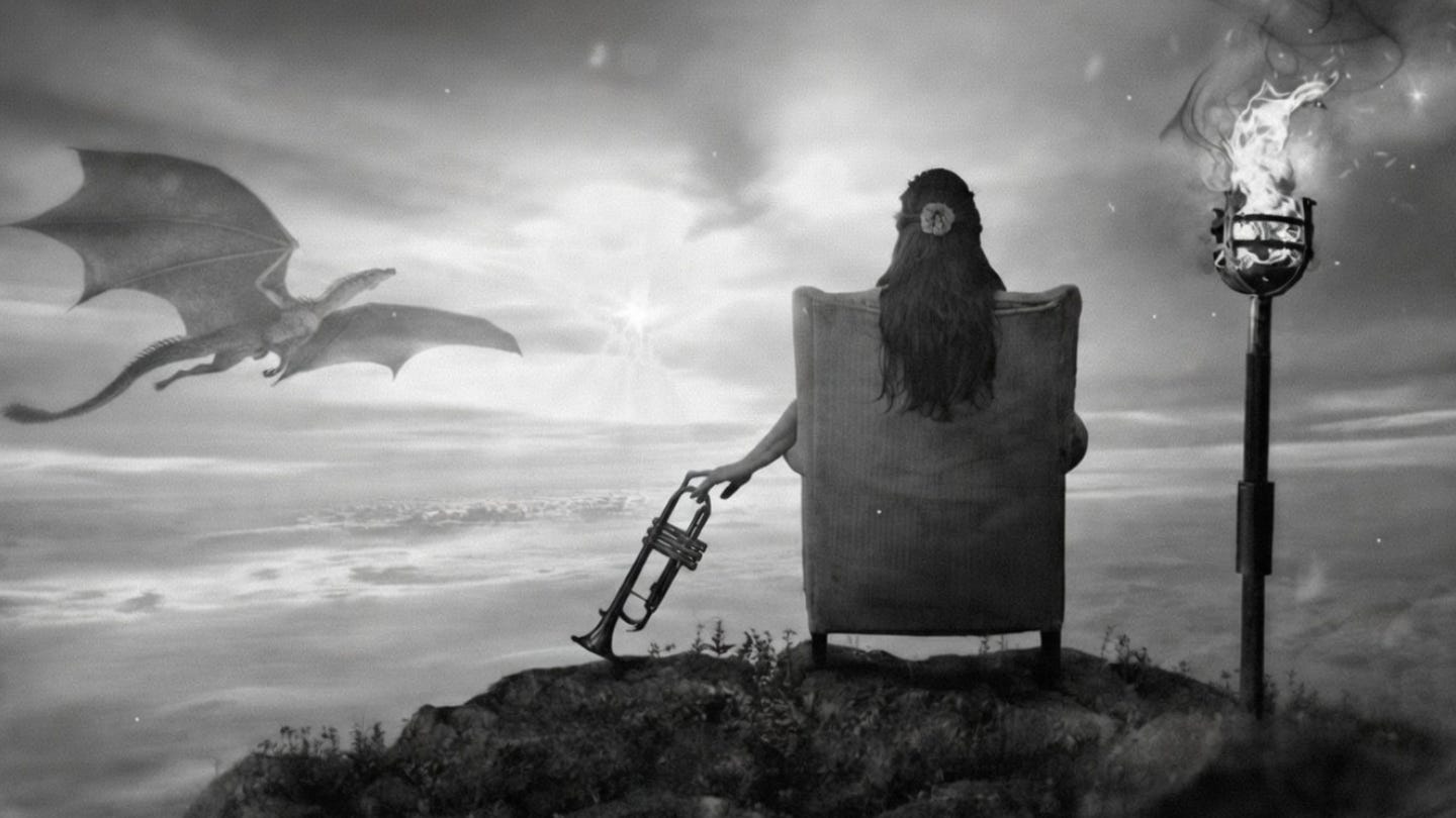 A cinematic, high-resolution black-and-white landscape of a person in a chair overlooking a surreal horizon with a dragon and a torch, representing the dream-like nature of synchronicity.