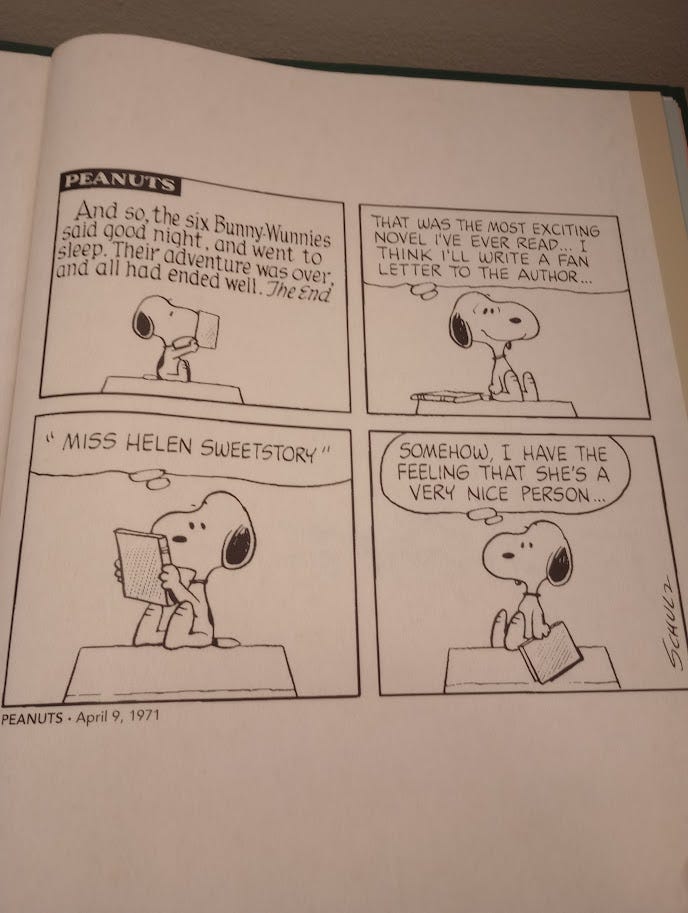 Snoopy reading and reflecting on the latest Bunny-Wunny book