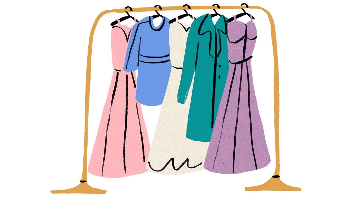 a clothing rack with dresses
