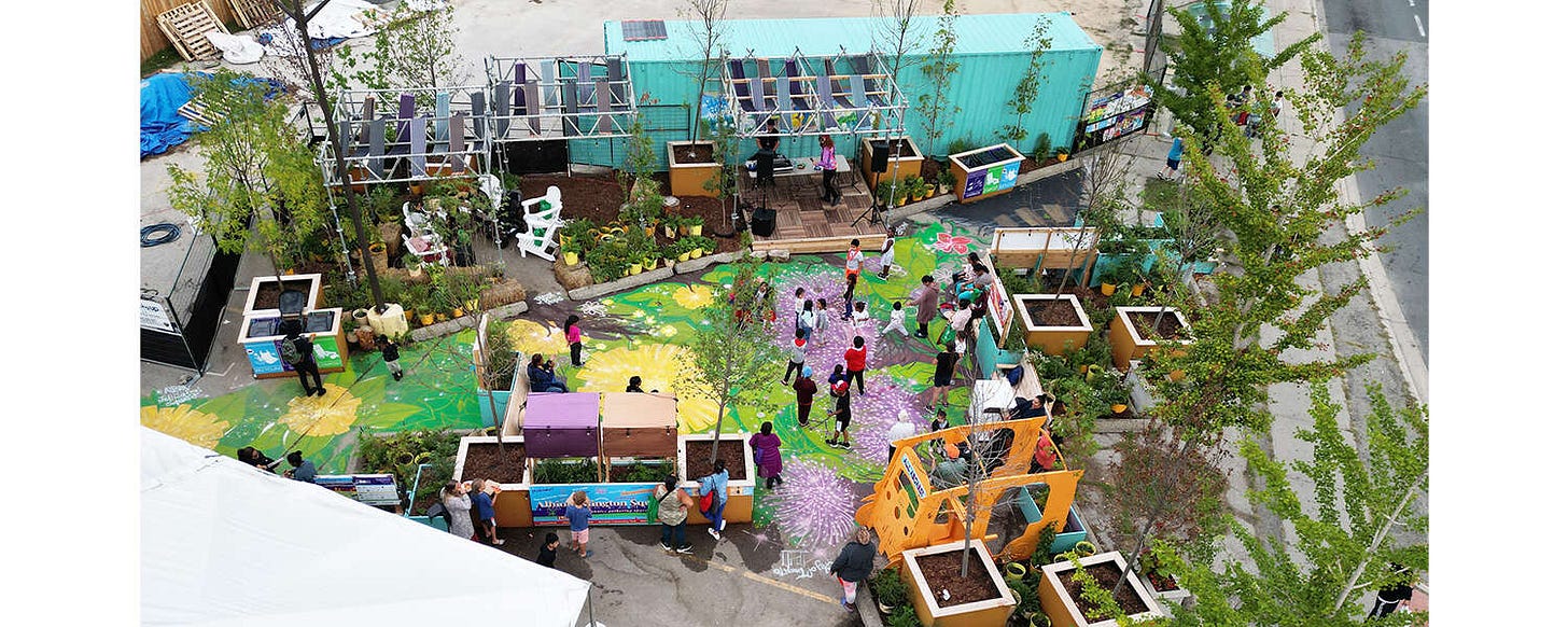 An aerial view of a plazaPOPs installation with brightly painted ground and several people walking among planters of plants and trees An aerial view of a plazaPOPs installation with brightly painted ground and several people walking among planters of plants and trees