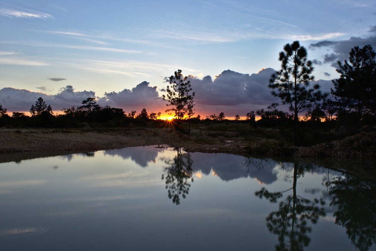 lake and sunset in Mountain Pine Ridge, Belize