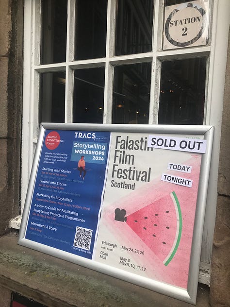 A poster for Falastin Film Festival saying 'sold out'; The room set for the Palestinian meal; Palestinian olives and chillies in small white bowls with cocktail sticks.