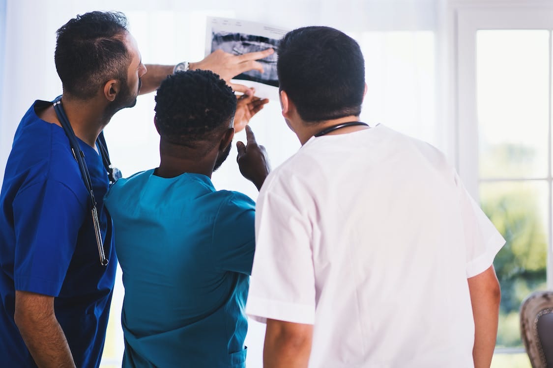 Free Three Person Looking at X-ray Result Stock Photo