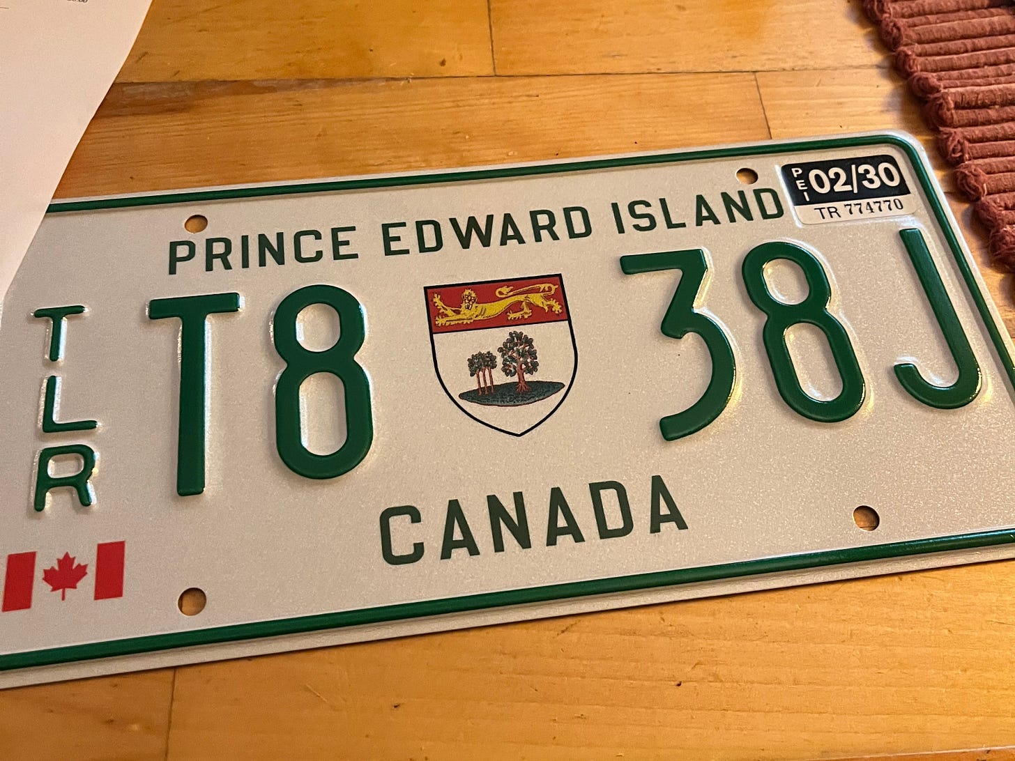 A new PEI license plate sits on my kitchen counter. It's a trailor plate, which doesn't expire until 2030!