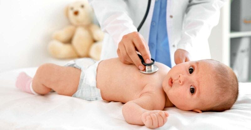doctor examining baby