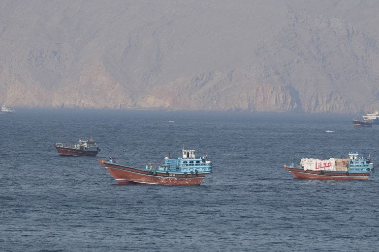 Ships and tankers in the Strait of Hormuz off the coast of Musandam, Oman