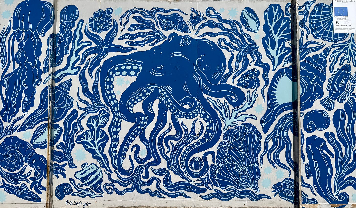 deep blue mural of octopus and other sea life