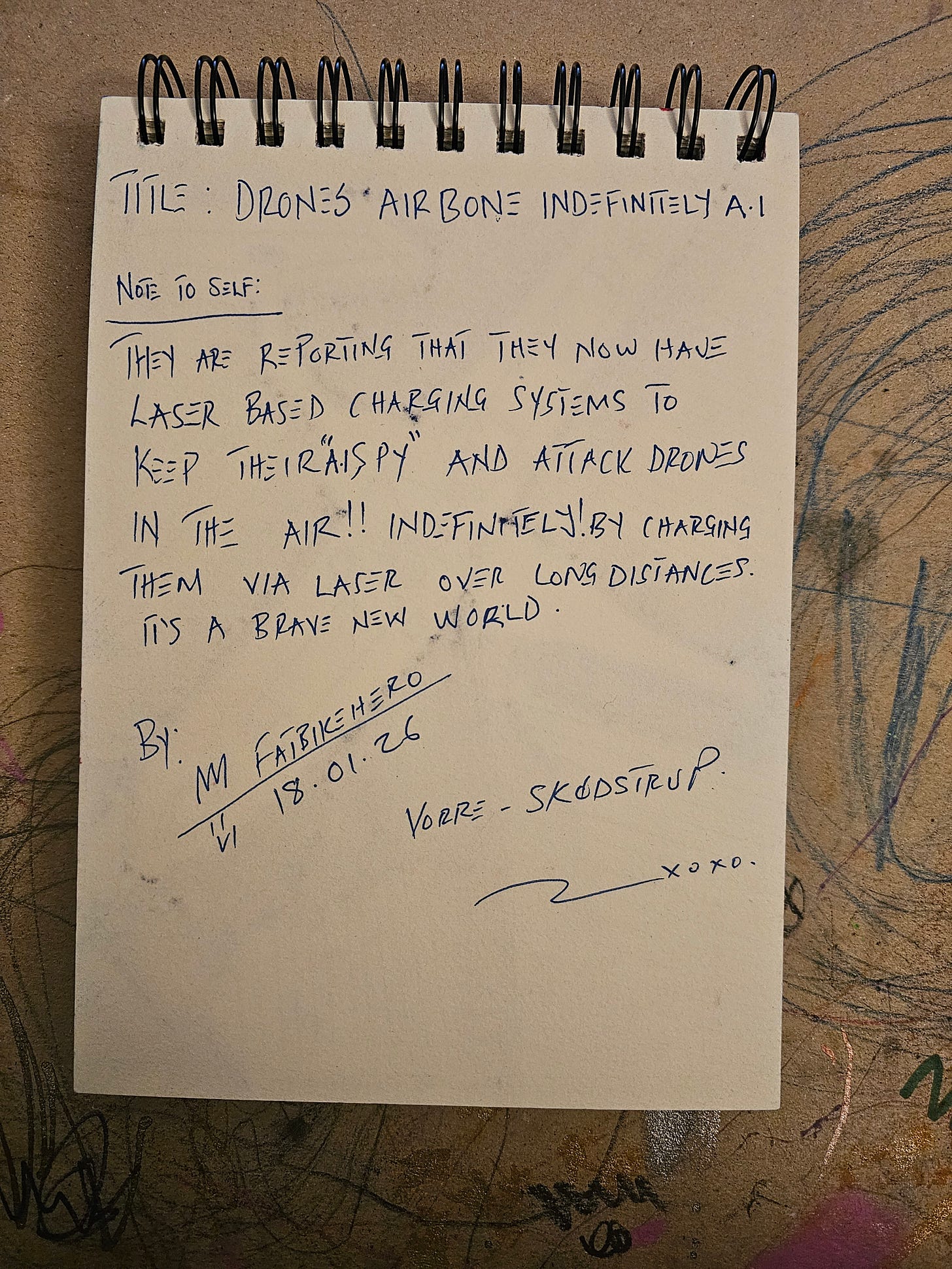 Alt Text: Handwritten notes by FatbikeHero dated 18.01.26. The text discusses "Laser Based Charging Systems" that keep AI spy drones in the air indefinitely, referencing a "Brave New World." Alt Text: Handwritten notes by FatbikeHero dated 18.01.26. The text discusses "Laser Based Charging Systems" that keep AI spy drones in the air indefinitely, referencing a "Brave New World."