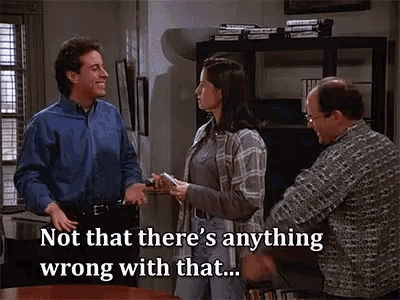 a group of people are standing around a table and one of them says not that there 's anything wrong with that .
