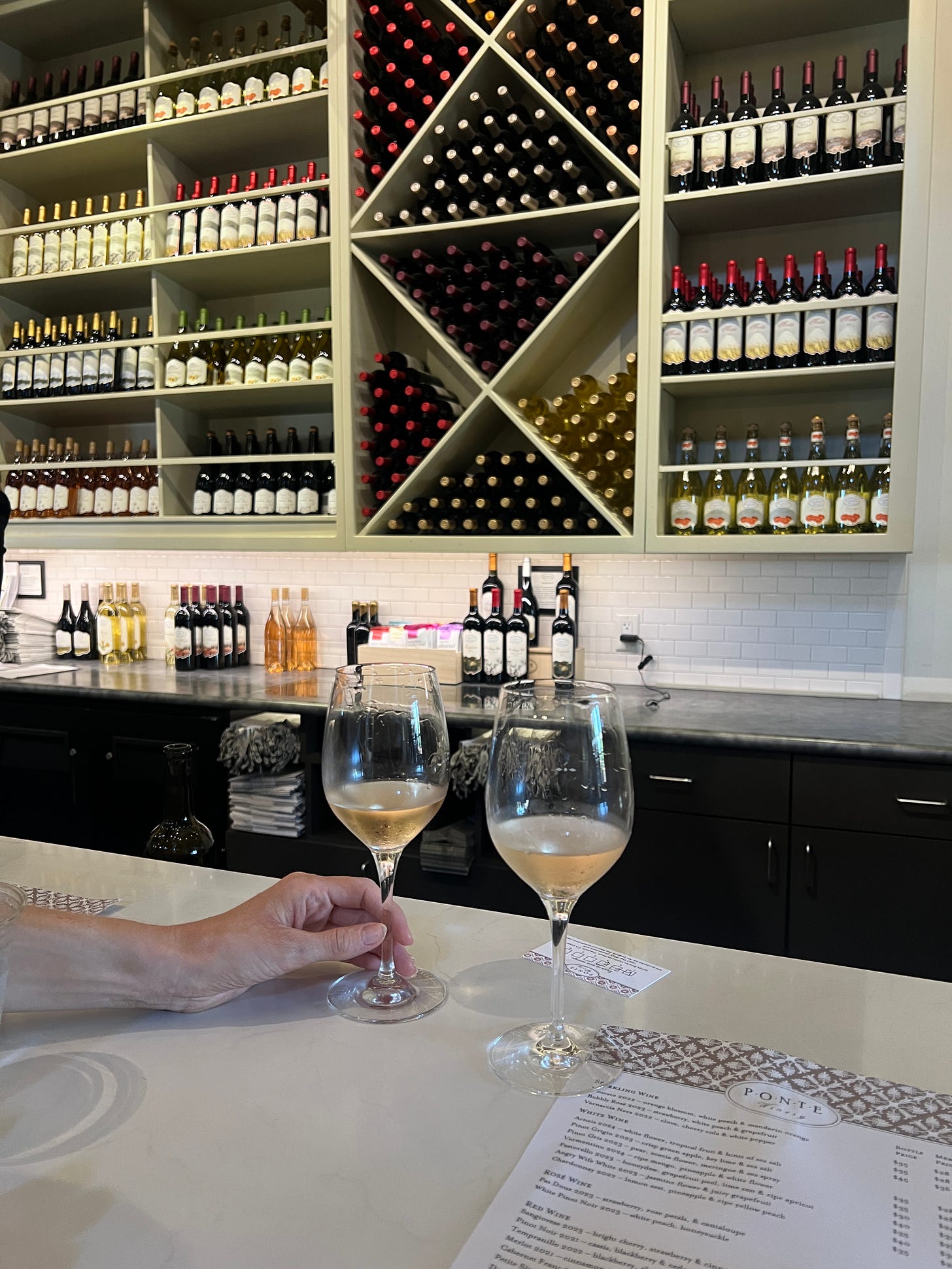 Ponte Winery tasting room in Temecula with two wine glasses of Vermentino or White Pinot Noir