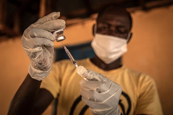 Preparing a Covid vaccine in the town of Kathantha Yimbo in Sierra Leone. The lack of reported Covid cases  in the country is raising questions about whether resources should  be directed at more urgent problems.