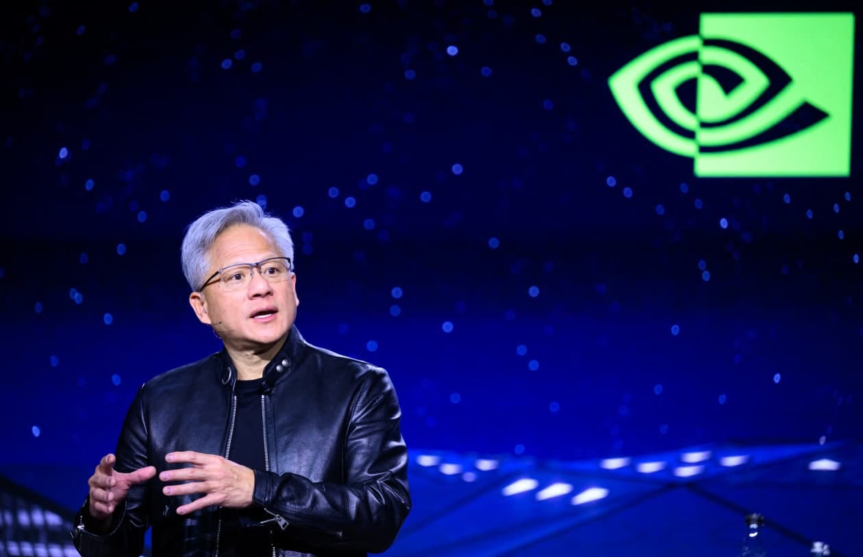 Jensen Huang, CEO of Nvidia, speaking at the GTC developers conference with a green Nvidia logo in the background. Jensen Huang, CEO of Nvidia, speaking at the GTC developers conference with a green Nvidia logo in the background.